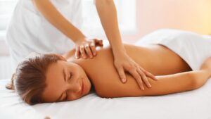 a woman having a massage at a day spa.